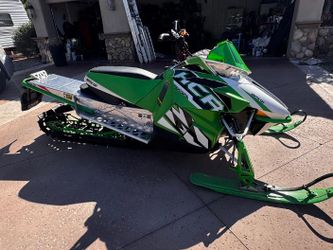 Arctic Cat snowmobile and Triton trailer