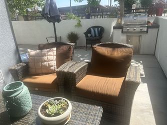 2 sunbrella  wicker chairs in good condition