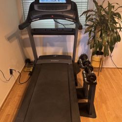 Nordic Track Commercial 2950 Treadmill With Interchangeable Hand Weights.