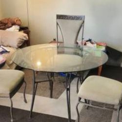 Table and three chairs
