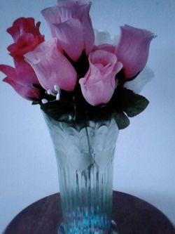 Artificial flowers in plastic vase