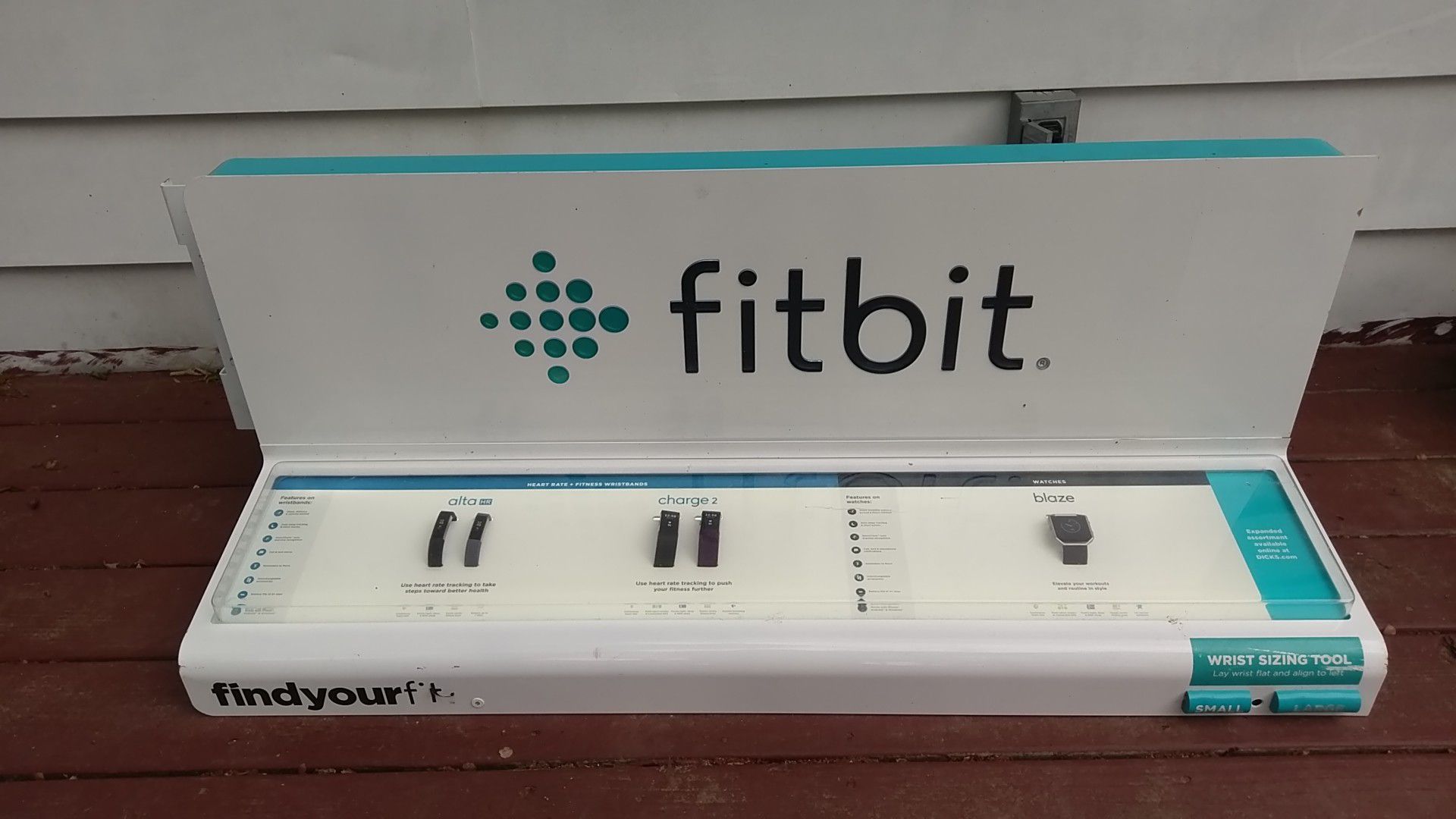 Built in LED lights FitBit sign. With fitness sample watches