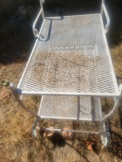 Vintage white wrought iron bar cart with wheels