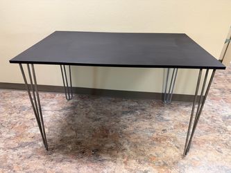 Black desk with iron table legs