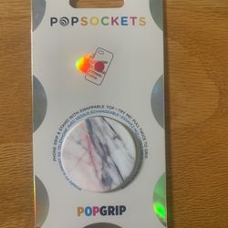 Marble-like pop socket for phone.