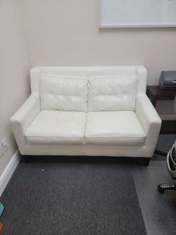 White faux leather love seat