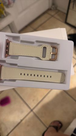 This cream-colored leather Apple Watch band features rose gold hardware.