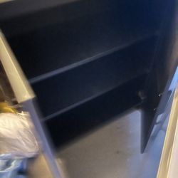 Black wood cabinet with shelves