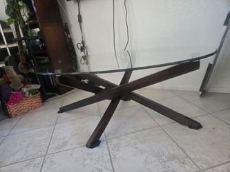 Oval shaped glass coffee table w/ wooden legs