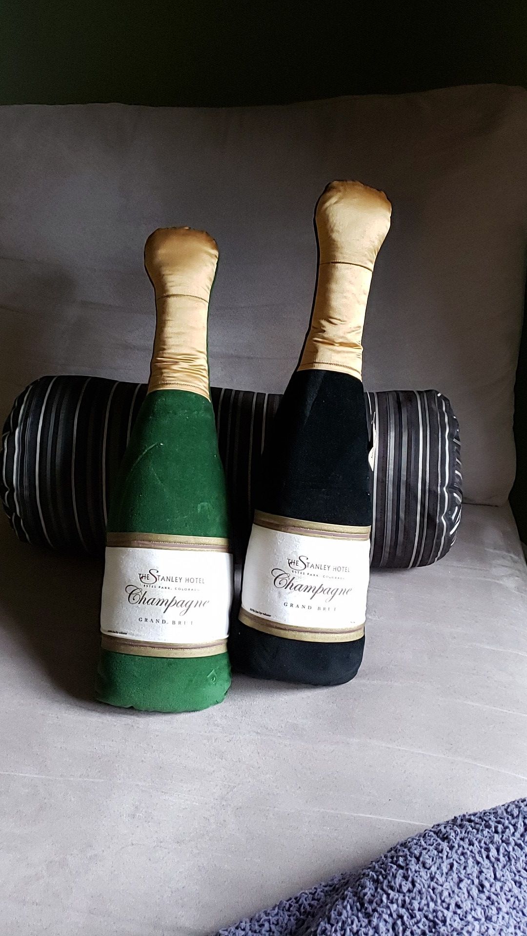 Sofa pillows, champagne bottle.shaped