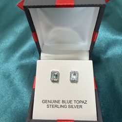 Blue topaz on sterling silver stud earrings.