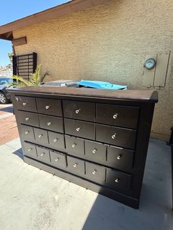 Dark Brown Wood Dresser with Multiple Drawers