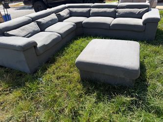 Grey sectional with ottoman