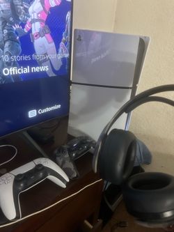 PS5 with headset and two controllers