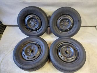 Ready to bolt on set of oem steel wheels and tires for Nissan Maxima 1995–1999