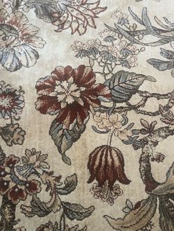 Vista Home Distressed Traditional Floral Area Rug in beige and grey/blue tones.