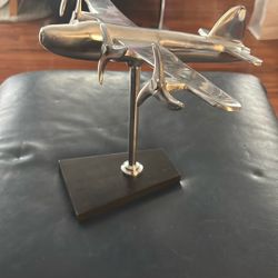 Chrome Airplane Elevated On a Black Base