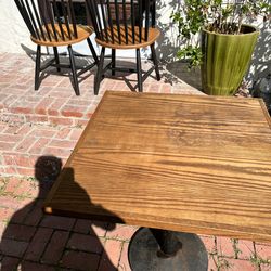 Wooden square table with metal post