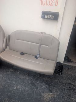 2 Leather captain chairs and wide leather seat for a 2008 Ford E 150 XLT Ecoline