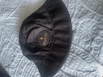Gucci bucket hat or Prada