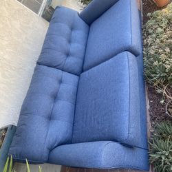 Blue Couch With Bed Underneath 