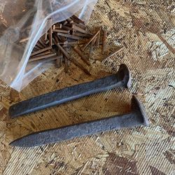 100 antique square nails and two railroad spikes