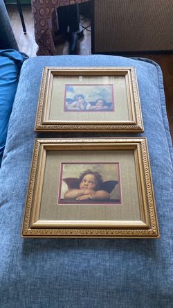 Set of two framed cherubs by Leonardo da Vinci