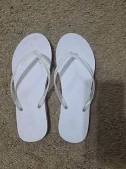 Almost new white flip flops