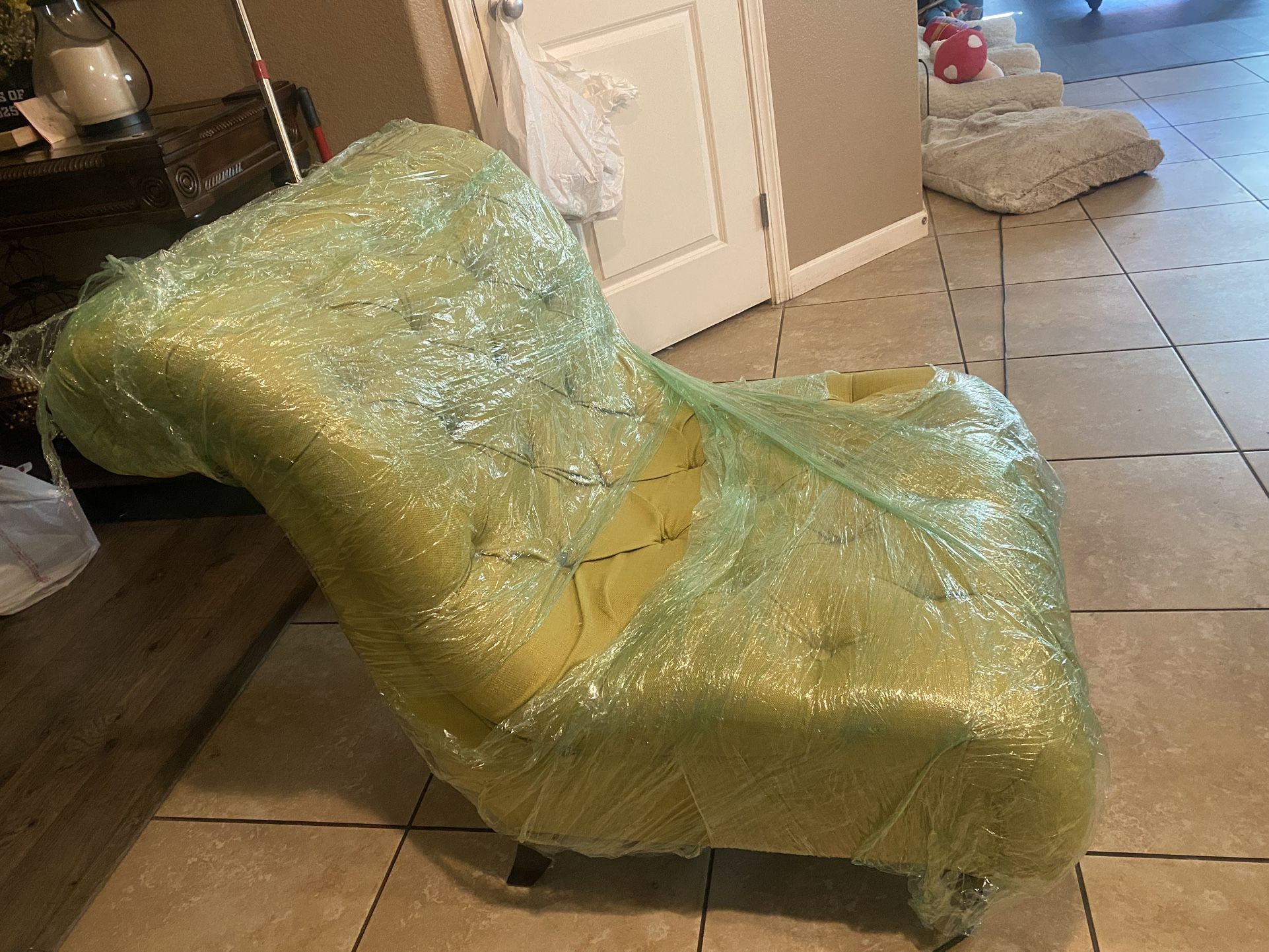 Green Lounge Chair and living Room Table With Glass Cover