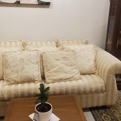 Beautiful Sleeper and Loveseat, Cream in Color with lots of beautiful pillows and Slip Covers