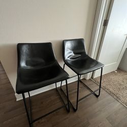 Two black island kitchen chairs 