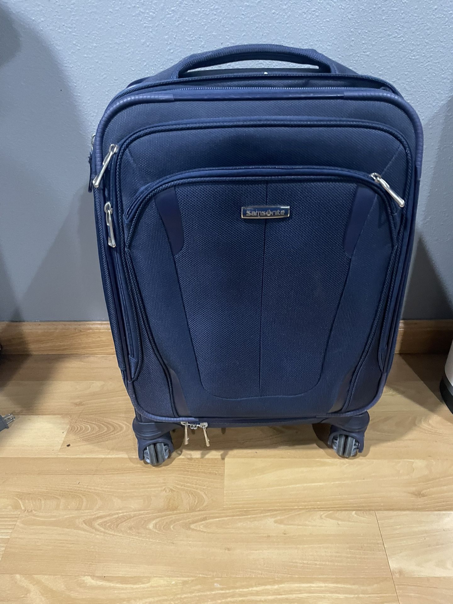 Nice Blue Carry On With 4 Wheels ( Excellent