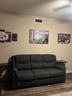 Grey three seated recliner