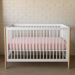 Modern White Baby Crib with Natural Wood Legs + Pink Mattress 