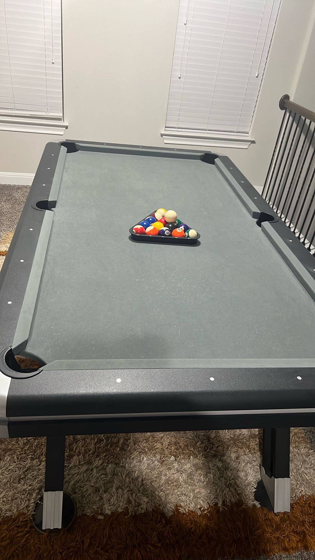 Billiards Table with sticks and balls
