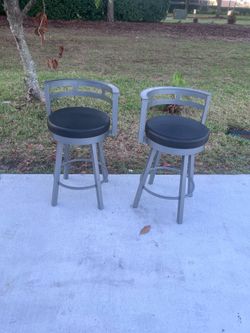 Lot of two 26in swivel barstools solid heavy metal. Made in Canada. Used in good condition with some minor pealing on a small edge.  Location below 31