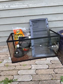 40 gal terrarium with locking lid, opening front doors, 1 bag unopened repot bark and heat lamp