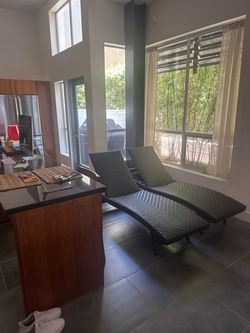 2 woven lounge chairs $300