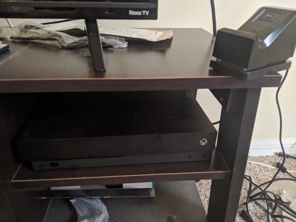 Xbox One X with 3 controllers and a wireless battery + charger stand