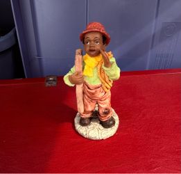 collectible figurine of “Toby” from the All God's Children collection by artist Martha Holcombe