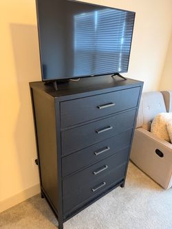 Matching Black dresser and nightstand with USB ports.