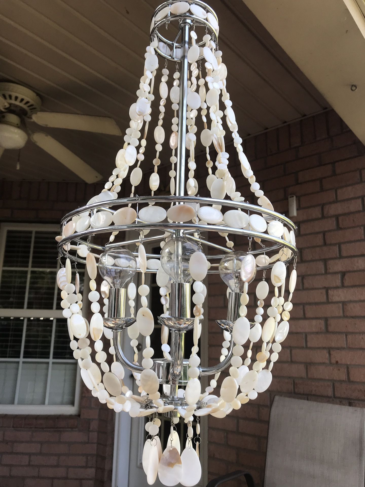 Sea Shell Chandelier- like new. 4 - 40watt bulbs- great for hanging over table.