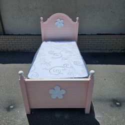 Pink twin-size bed frame with brand New twin size plush mattress and box spring 