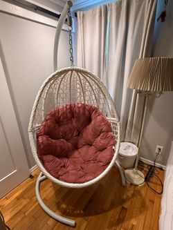 Large white swinging egg chair