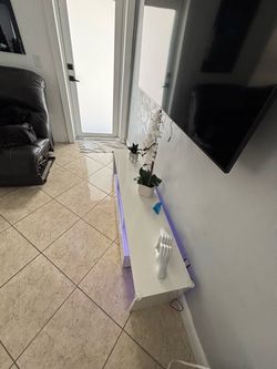 What Table stand with LED, glass shelf’s and drawers
