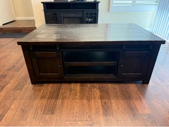 Rustic, dark brown coffee table with sliding barn doors