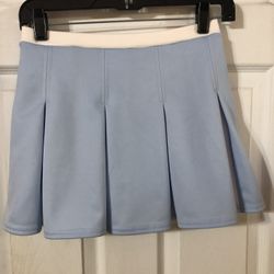 Girls Size Large Cheer Leader Style Skirt with light blue built in shorts.  Color light blue with shorts underneath.  Made of 100% Polyester Brand new