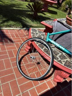 Fixie chrome, rim, and tire , black handlebars