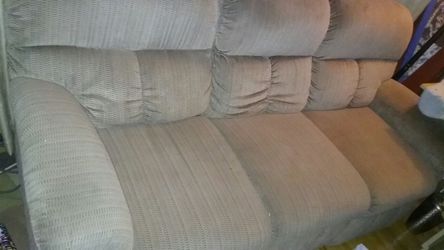 Light brown dual reclining sofa both sides work excellent when reclining in super great shape