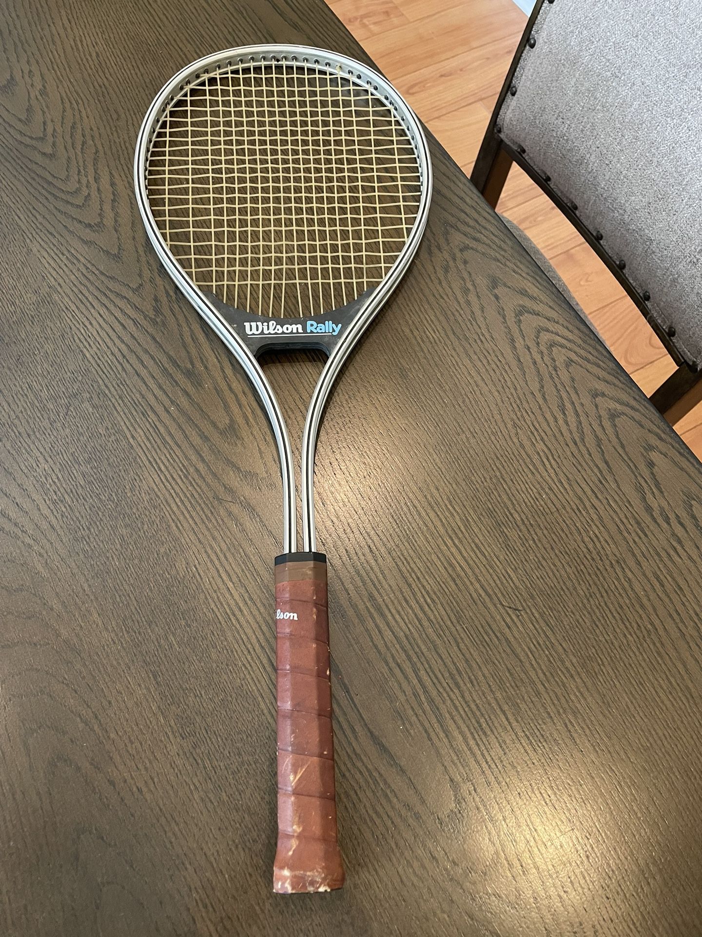 Vintage Wilson Rally Tennis Racquet With Mid Size Grip.